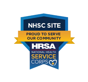 Badge with text: NHSC Site - Proud to Serve Our Community above, and HRSA National Health Service Corps below with a heart and cross symbol.