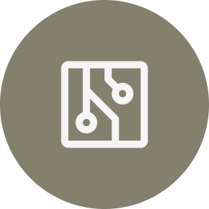 A round, gray icon featuring a white, abstract design resembling a circuit board with lines and circles.
